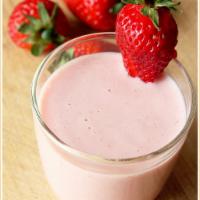 Strawberry Lassi · Refreshing yogurt drink blended with strawberries and homemade yogurt. 