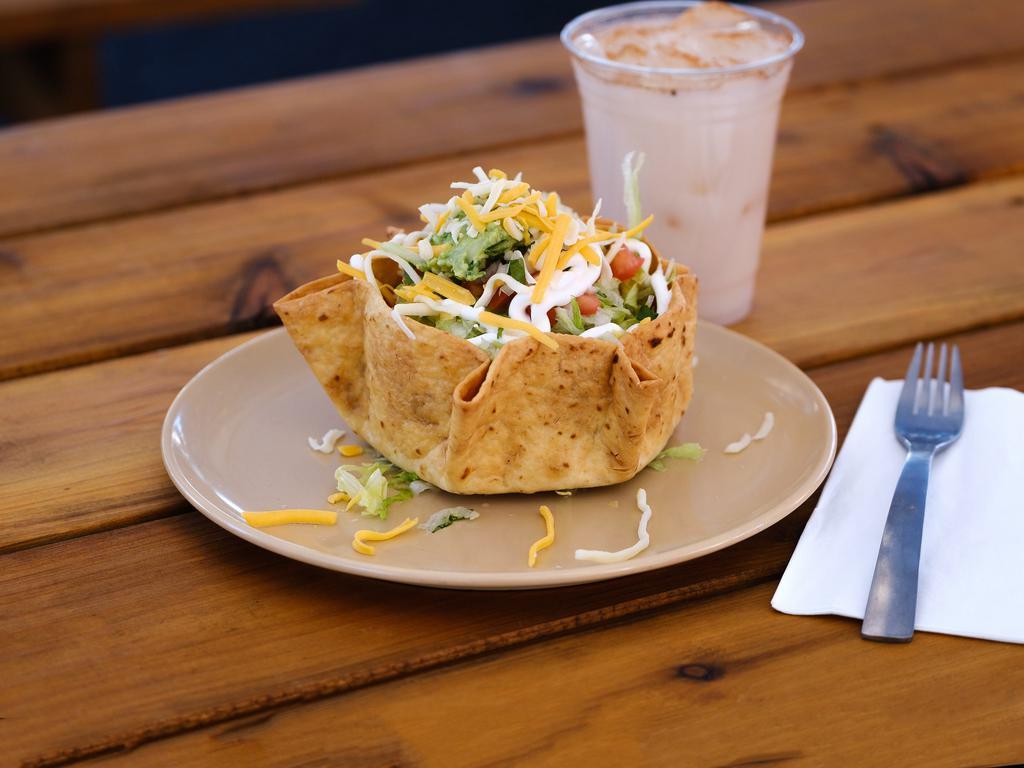 Taco Salad · Choice of meat, rice, beans, lettuce, cheese, pico, sour cream and guac