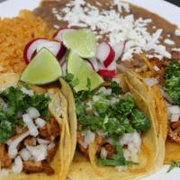 Taco Combo · 3x tacos (choice of meat), rice, beans, cheese and limes