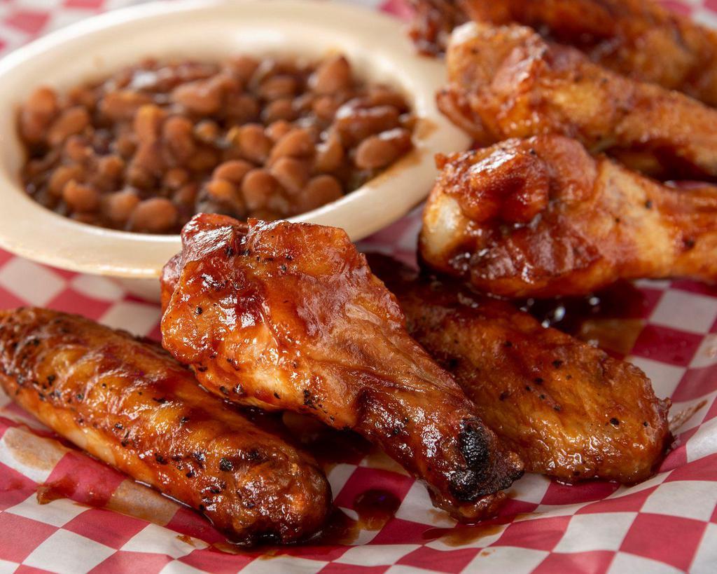 BBQ Wings · Bone-in wings. Awesome wings with signature BBQ sauce served with baked beans.