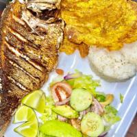 Mojarra Frita (Fried Fish Mojarra) · Fried mojarra. Served with rice, salad and fried green plantains.