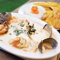 Cazuela de Mariscos · Mixed seafood in casserole. Fried green plantains and rice.