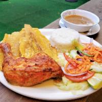 POLLO AL HORNO- BAKED CHICKEN · Roasted chicken with rice, salad and fried plantains.