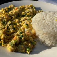 Huevos Pericos con Arroz · Scrambled eggs with tomato and onion, Served with rice.