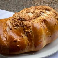 Pan de Queso (Grande) - Cheese Bread (Large) · Bread topped with cheese and a cheese filling
