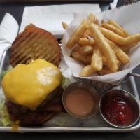 Burger · Hand made burgers well seasoned  on a brioche bun with lettuces and tomatoes with house sauc...