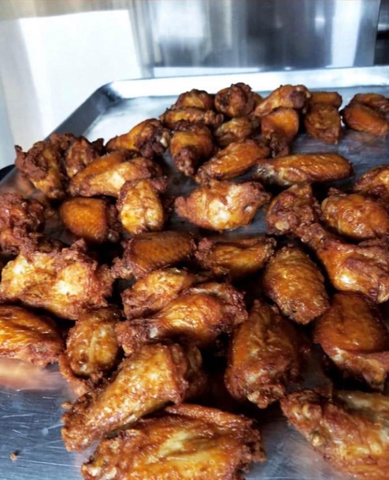 Chicken Wings 25 or 50 Pieces · Seasoned fresh chicken wings never frozen lightly breaded wings only no fries 