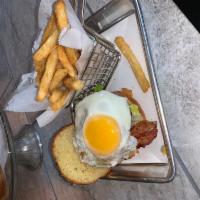 Amores Burger · Hand made burgers well seasoned  on a brioche bun with fried egg bacon lettuces and tomatoes...