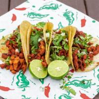 Al Pastor Tacos  · 4 tacos: All natural cut pork , soaked in home made marinade, grilled to perfection served o...