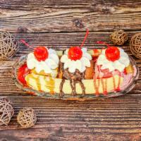 Banana Split · 3 scoops of ice cream in split banana boat.
Choose topping from fudge or caramel or strawber...