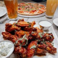 Chicken Wings  · Buffalo, sweet bourbon BBQ, the jerk, and garlic Parmesan.