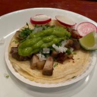 Carnitas Taco · Fried Pork, Corn Tortilla, Guacamole, Cilantro, And Onion, With Side Of Radish, And Lime