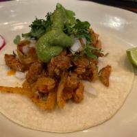  Carne Enchilada Taco · Spicy Pork Meat, Corn Tortilla, Guacamole, Cilantro, And Onion, With Side Of Radish, And Lime