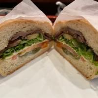 Bistec  Torta  · Cooked beef, Lettuce, Tomato, Mayonnaise, Avocado, Black Beans, Fried Cheese, And Jalapeno