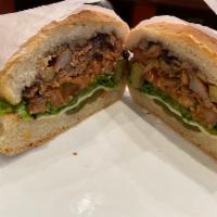 Torta De Al Pastor  · Al Pastor (Pork) ,Lettuce, Tomato, Mayonnaise, Avocado, Black Beans, Fried Cheese, And Jalap...