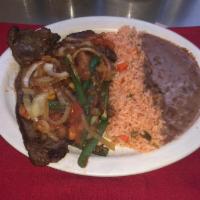 Bistec a La Mexicana Platillo · Grilled Steak With  Onions ,Tomato, Jalapeno, Rice And Beans