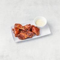 Buffalo Wings · BBQ or hot and spicy served with blue cheese dressing.