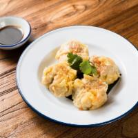Homemade  Dumplings (kanom jeeb) · Khanom jeeb. Steamed chicken and shrimp dumplings served with soy vinaigrette.