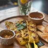 Chicken satay · Grilled marinated chicken served with peanut sauce,  cucumber relish, toasted bread