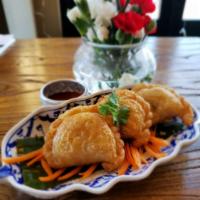 Curry puff · homemade puff pastry stuffed with chicken, onion, potato and curry powder with  cucumber rel...