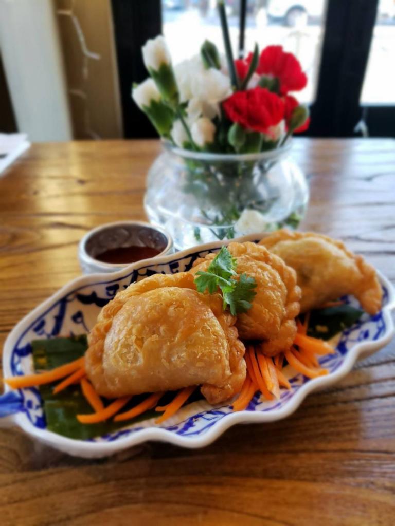 Curry puff · homemade puff pastry stuffed with chicken, onion, potato and curry powder with  cucumber relish