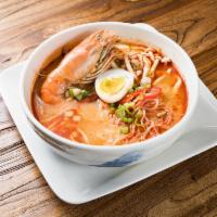Tom Yum Noodle Soup · Mushrooms, bean sprouts, and evaporated milk in spicy lemongrass broth.