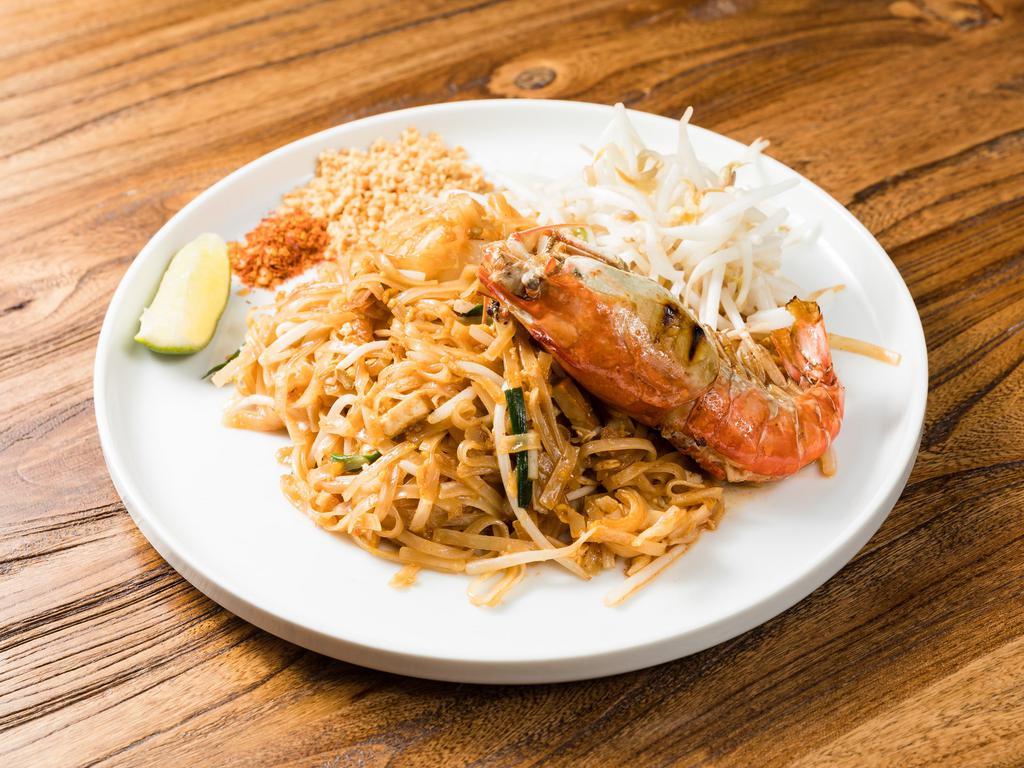 Sup Pad Thai · Traditional Thai dish stir- fried thin rice noodles, bean sprouts, chive leaves, peanuts, bean curd and Thai tamarind sauce.