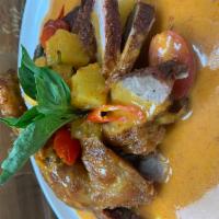 Crispy duck with pineapple red curry sauce  · Crispy half duck, lychee, pineapple withe coconut red curry sauce 