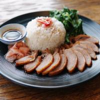 Duck over rice · crispy duck breast, chinese broccoli, pickled ginger with homemade soy vinaigrette 