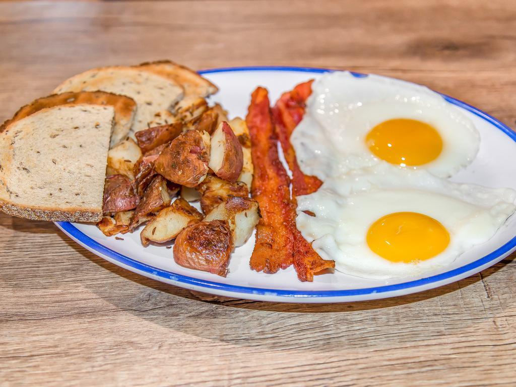 Fry Up  · 2 eggs fried, scrambled, or poached your way, served with our own home fries, choice of toast and select bacon, sausage or ham. Add 2 pancakes for an additional charge,