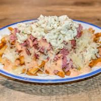 Schmutz Sandwich Plate  · Our twist on a Rochester favorite. Dive into a plate of crispy fries piled high with pastram...