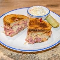 Reuben Sandwich · Melt in your mouth corned beef with melted Swiss, Russian dressing and sauerkraut on rye gri...