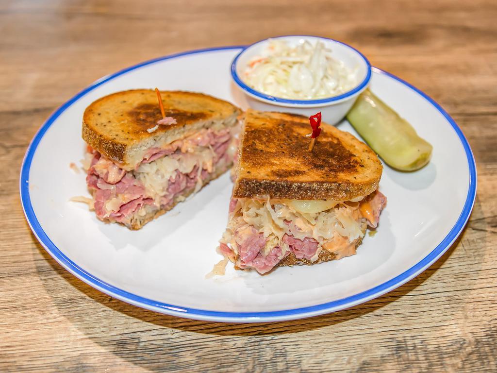 Reuben Sandwich · Melt in your mouth corned beef with melted Swiss, Russian dressing and sauerkraut on rye grilled to a golden crisp.