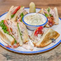 The Frontier Sandwich · It is always a home run with this club. A triple decker club sandwich with roast turkey, cri...