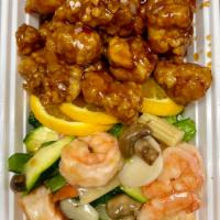 S9. Dragon and Phoenix · General tso's chicken and white sauce jumbo shrimp joined in a unique matrimony. Hot and spi...