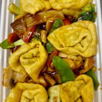 S11. Subgum Wonton · Beef, chicken and pork mixed with assorted vegetable in brown sauce. Served with 6 spicy won...