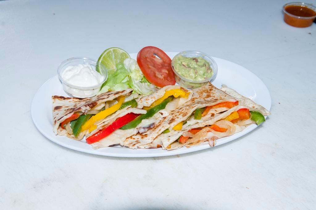 Veggie Quesadilla · Flour tortilla, sauteed bell peppers and onion, cheese guacamole and sour cream.