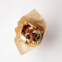 Roasted Chicken Pita · Slow roasted chicken marinated in mint, sumac and honey stuffed into a freshly baked pita po...