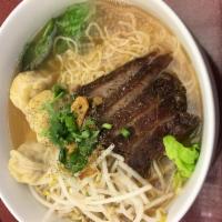 N3. Wonton Noodles Soup · Egg noodles, chicken wontons, cilantro, scallions, bean sprouts, green leaf and roasted pork...