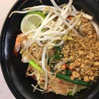 T1. Pad Thai · Thin rice noodles stir-fried with egg, bean sprouts, scallions, bean curd and crushed peanut...