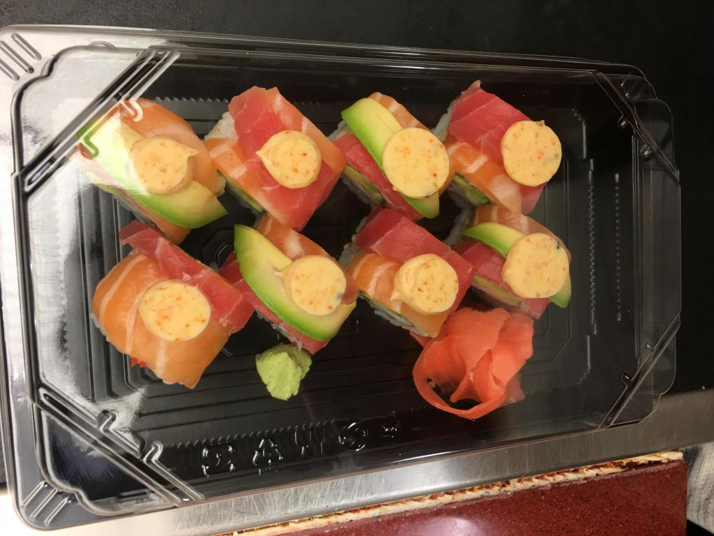 M6. Rainbow Roll · Crab stick, avocado, cucumber, tuna and salmon.