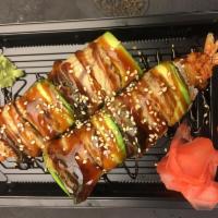 M7. Dragon Roll · Shrimp tempura topped with eel, avocado and unagi sauce.