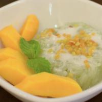 D1. Mango Sticky Rice · Slices of ripe mango and sweet sticky rice drizzled with mung beans and coconut milk.