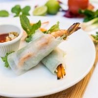  Tom Cuon · Rolls of grilled prawn with cucumber, fresh herbs, and peanut sauce.