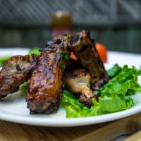 Dinner Suon Nuong · Grilled back ribs marinated with 5 spices.