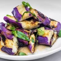 Dinner Ca Tim · Grilled eggplant with ginger and lime sauce.