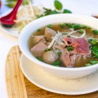 Dinner Pho Bo · Beef soup with rice noodles and aromatic herbs.