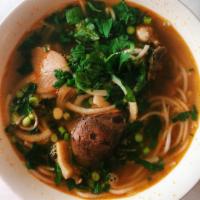 Dinner Bun Bo Hue · Spicy lemongrass-infused noodle soup with beef, pork shank, and fresh herb.