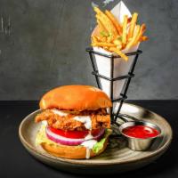 Chicken Sandwich · Fried or Grilled. Lettuce, Tomato, Onion, Pickled Peppers, Garlic Aioli, Fries.