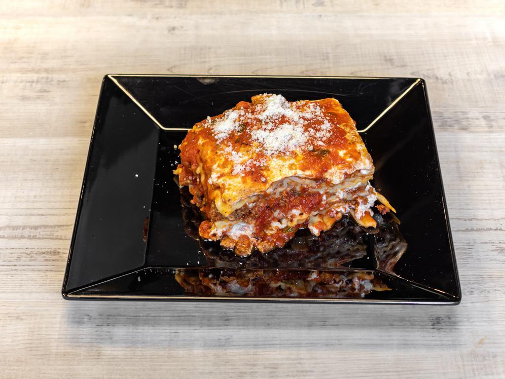 Lasagna · Homemade Bolognese sauce, bechamel, fresh mozzarella.